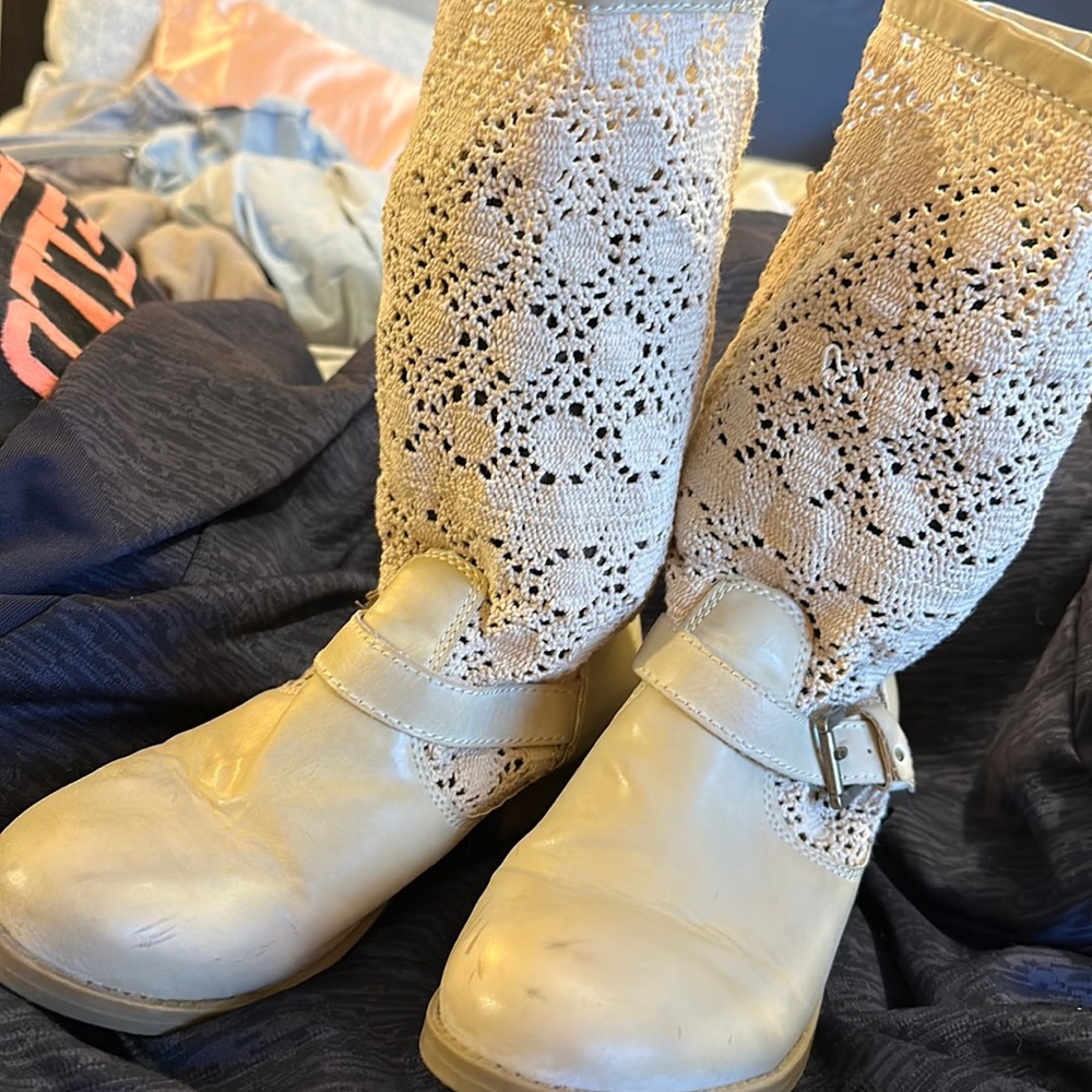 Cream, lace-design boots.